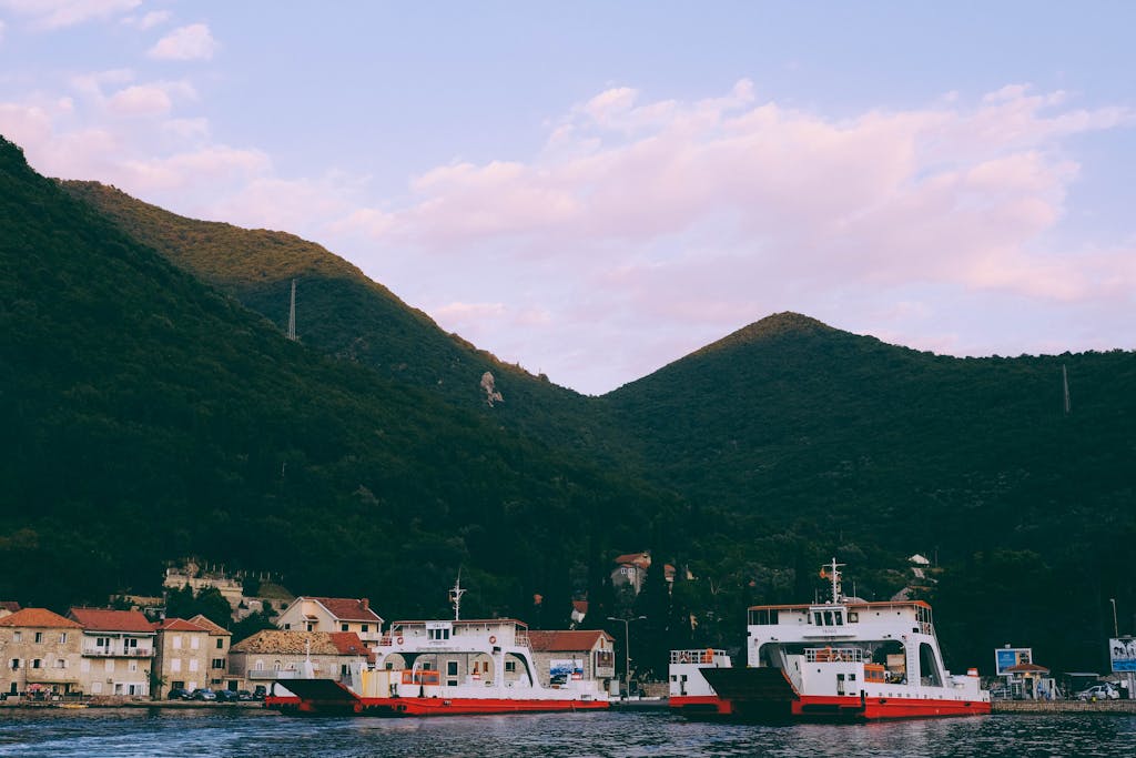 A Seaport Near Houses And Mountains